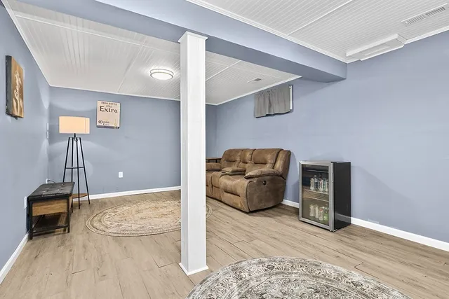 a living room with furniture and a rug