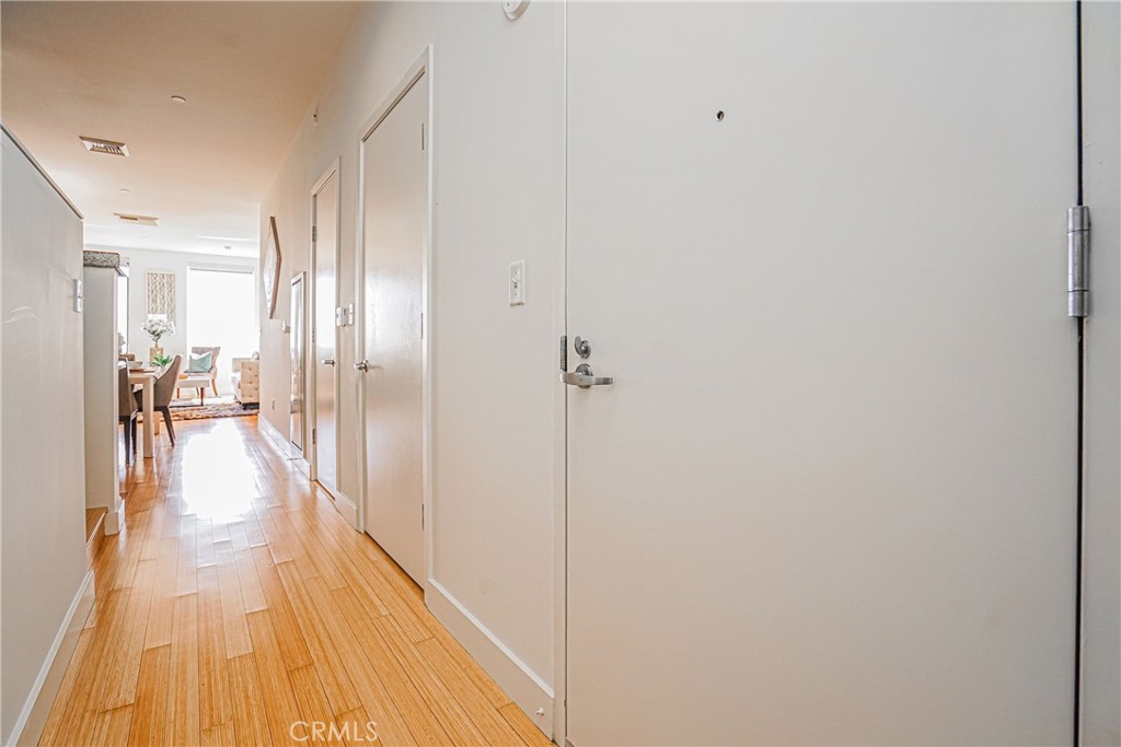 3810 Wilshire Boulevard, Unit 1409 Los Angeles, CA 90010 - Photo 15 of 41 a view of a hallway with wooden floor