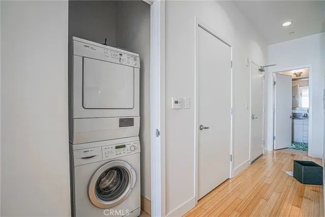 a view of a hallway with washer and dryer