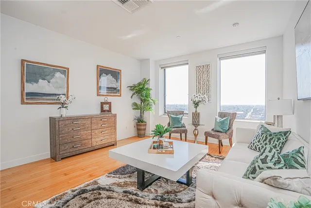 a living room with furniture rug and window
