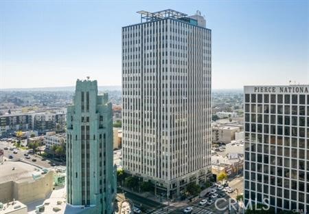 3810 Wilshire Boulevard, Unit 1409 Los Angeles, CA 90010 - Photo 26 of 41 a view of a city with tall buildings