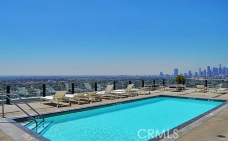 3810 Wilshire Boulevard, Unit 1409 Los Angeles, CA 90010 - Photo 27 of 41 a view of a swimming pool and lounge chairs