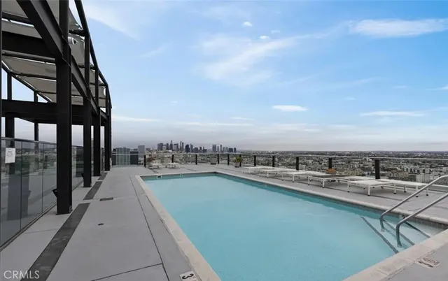 a view of a swimming pool with a chairs