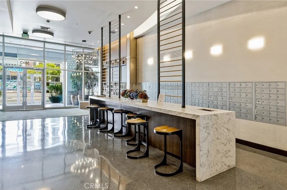 3810 Wilshire Boulevard, Unit 1409 Los Angeles, CA 90010 - Photo 40 of 41 a dining hall with stainless steel appliances granite countertop a granite counter tops and a view of living room