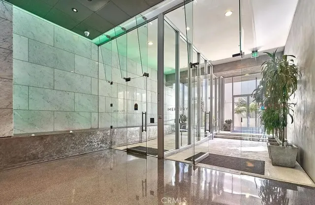 a bathroom with a shower and a sink