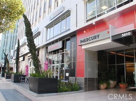 3810 Wilshire Boulevard, Unit 1409 Los Angeles, CA 90010 - Photo 6 of 41 a front view of a building with street