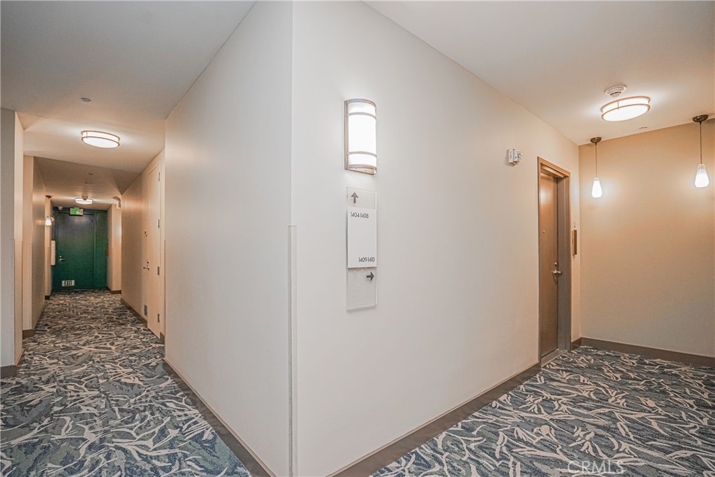 3810 Wilshire Boulevard, Unit 1409 Los Angeles, CA 90010 - Photo 7 of 41 a view of a hallway with wooden floor