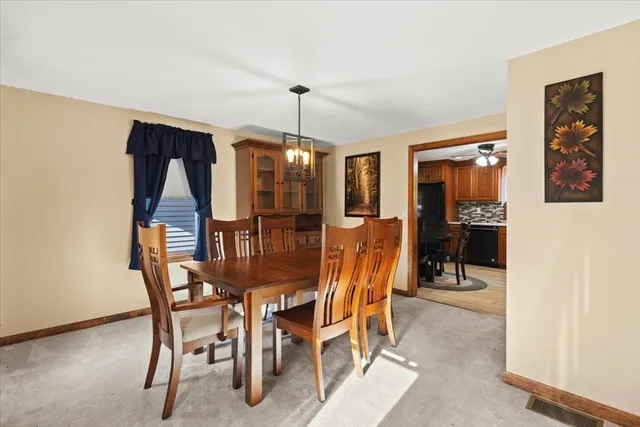 a dining room with furniture and window