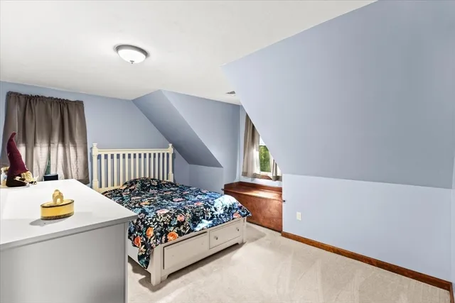 a bedroom with bed and a window