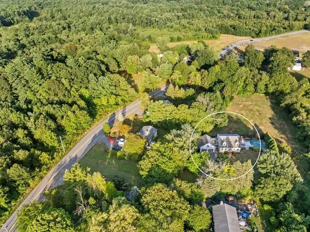 a front view of a house with a garden and plants