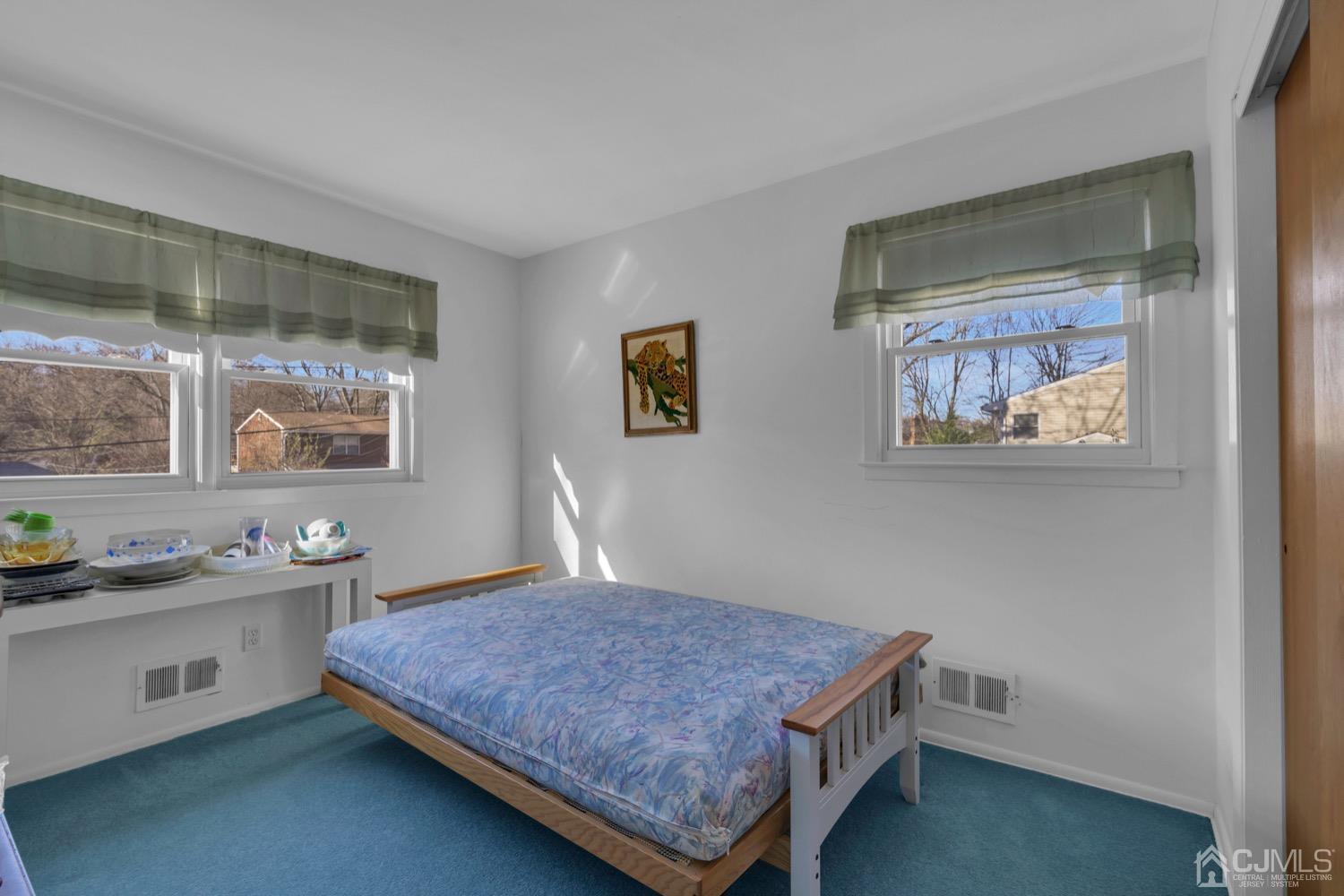 12 Butler Road Edison, NJ 08820 - Photo 29 of 41 a bedroom with a bed and a window