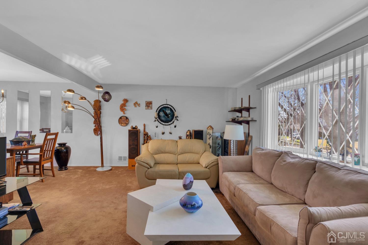 12 Butler Road Edison, NJ 08820 - Photo 8 of 41 a living room with furniture and a large window