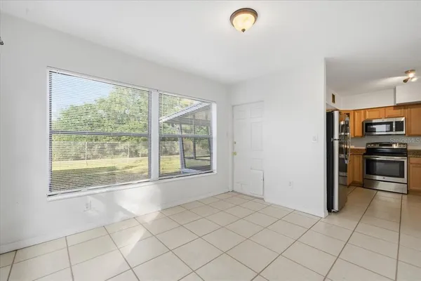 a view of a kitchen with a sink dishwasher and a refrigerator