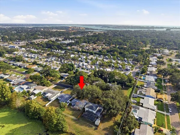 an aerial view of residential houses with city view and lake view