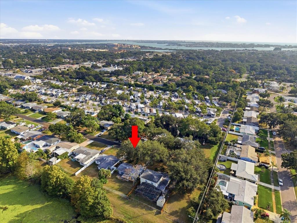 10971 57th Avenue Seminole, FL 33772 - Photo 24 of 26 an aerial view of residential houses with city view and lake view
