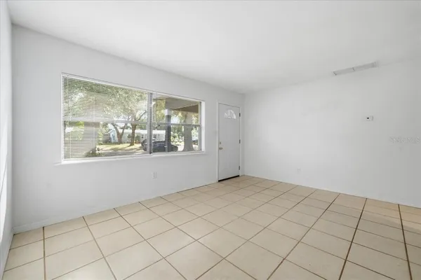 a view of an empty room and window