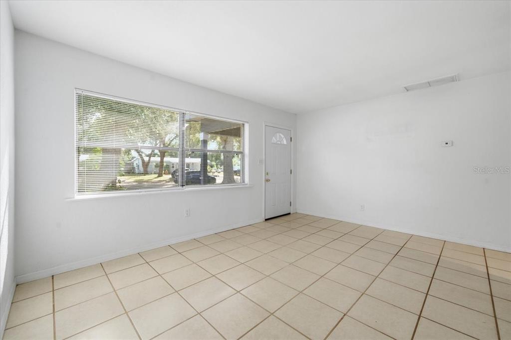 10971 57th Avenue Seminole, FL 33772 - Photo 4 of 26 a view of an empty room and window
