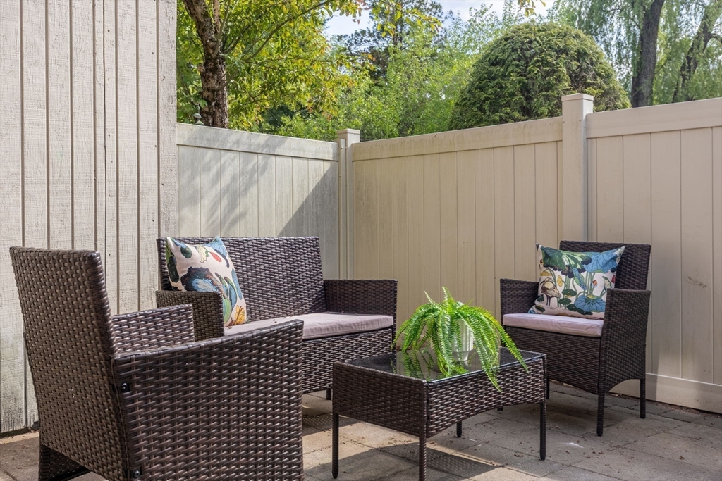 910 Edgell Road, Unit 914A Framingham, MA 01701 - Photo 12 of 22 a blue chair sitting in a balcony