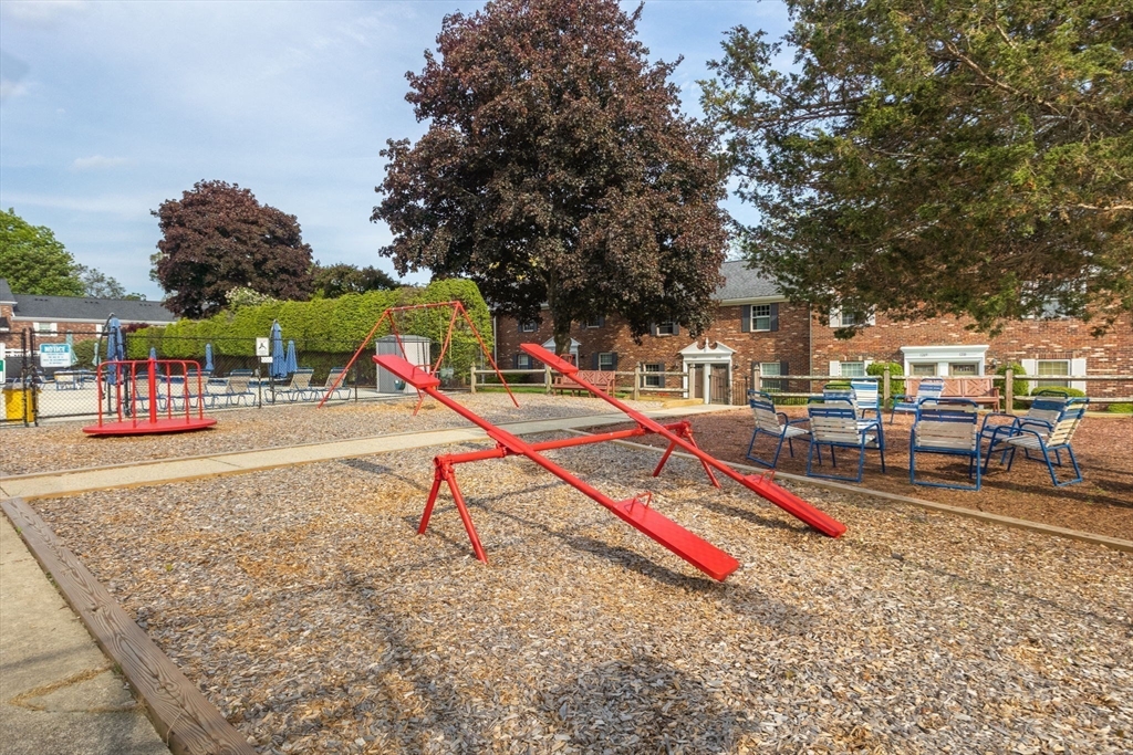 910 Edgell Road, Unit 914A Framingham, MA 01701 - Photo 22 of 22 a park with large trees and lawn chairs