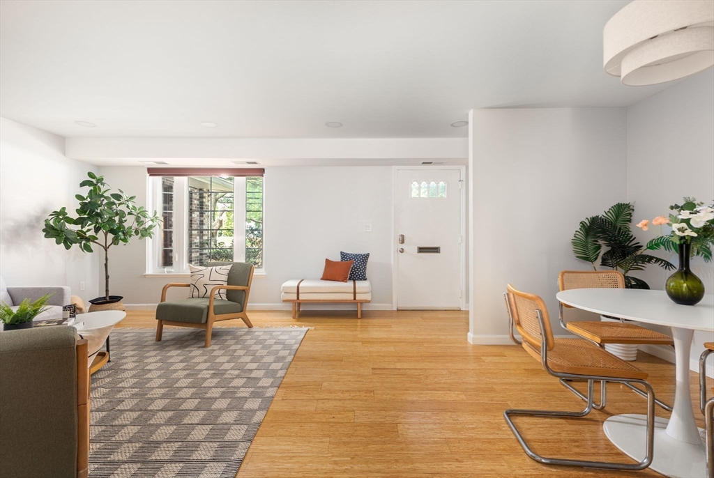 910 Edgell Road, Unit 914A Framingham, MA 01701 - Photo 4 of 22 a living room with furniture and a potted plant
