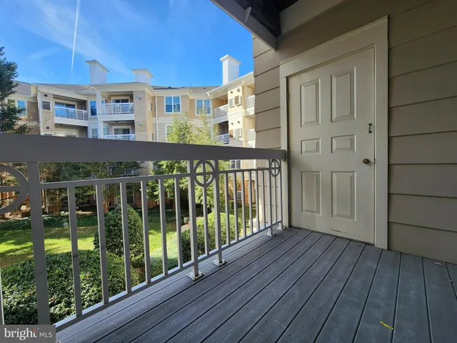 a view of a balcony with wooden floor