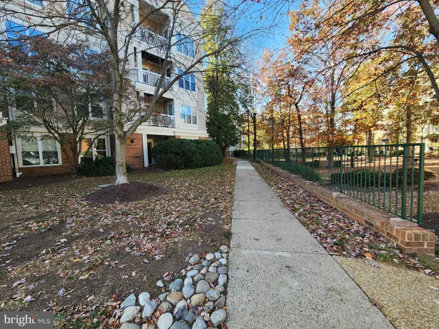 a pathway of a house next to a lake with lake view