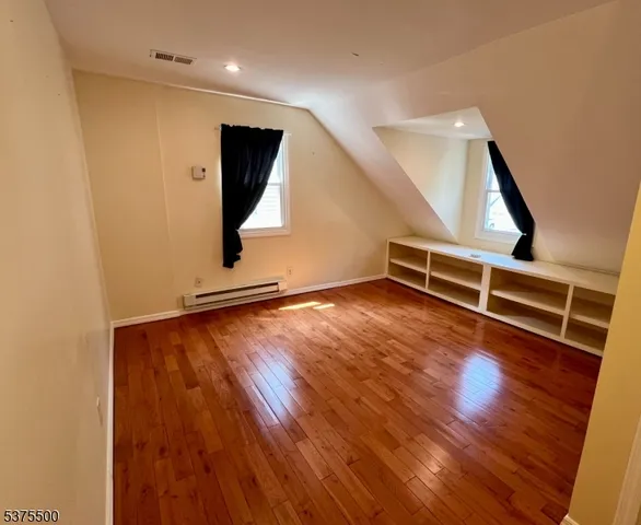 a view of livingroom with wooden floor