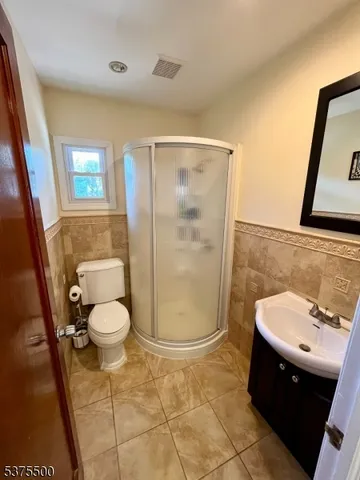 a living room with hard wood floors and a window