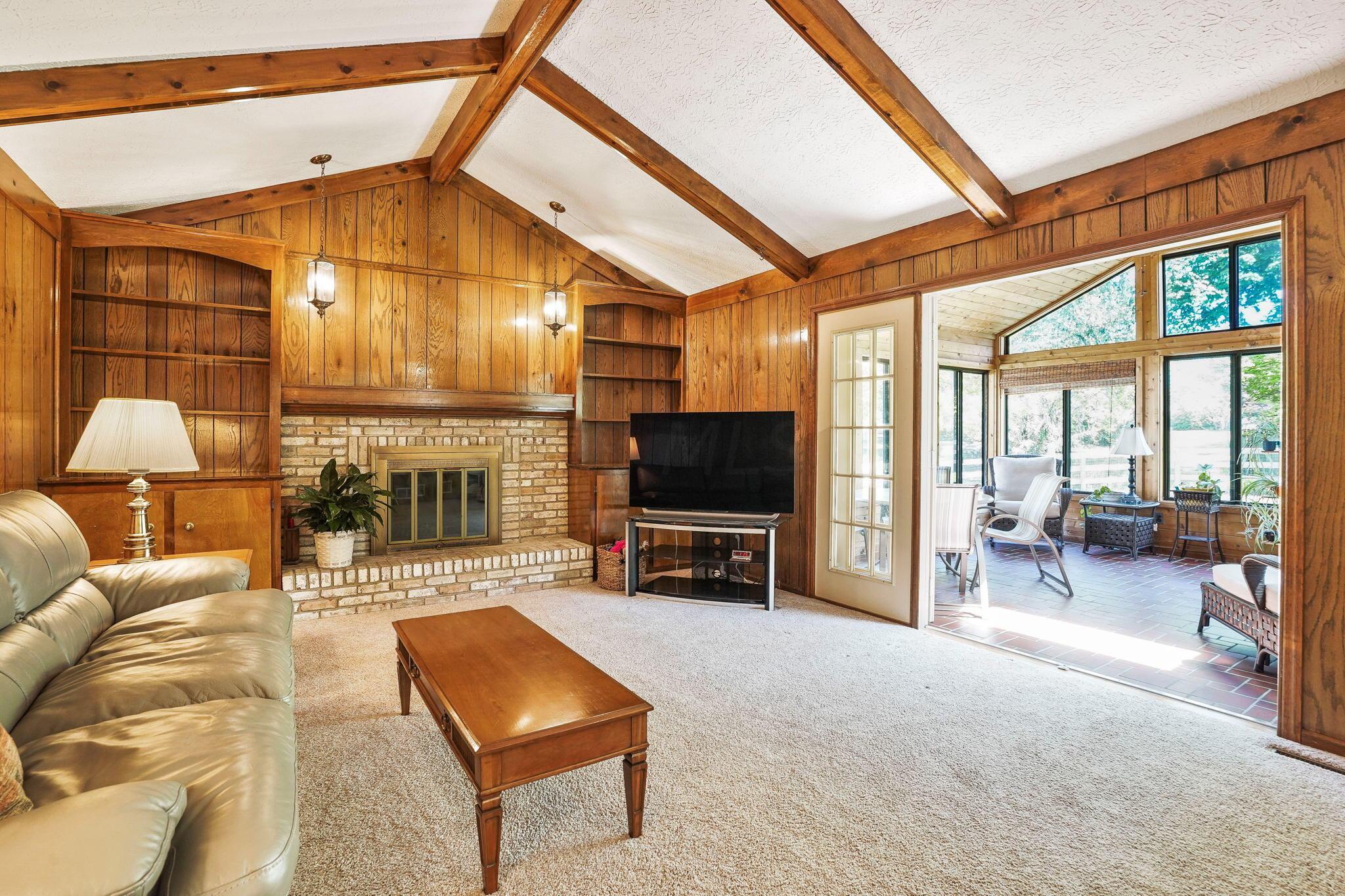1180 Chatham Ridge Road Westerville, OH 43081 - Photo 38 of 69 Large family room with fireplace with beamed vaulted ceilings