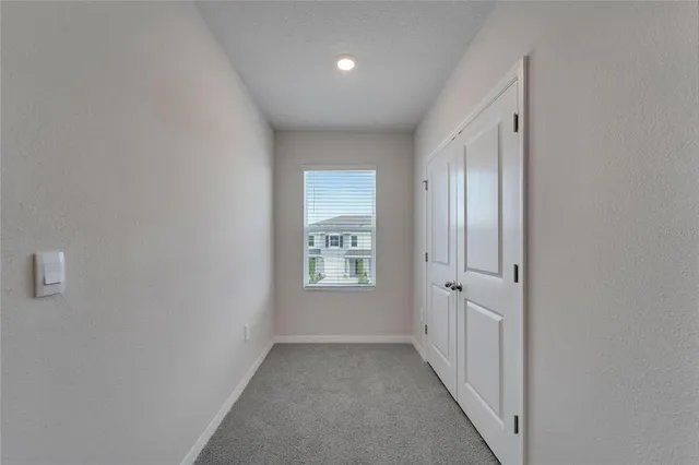 a view of an empty room and window