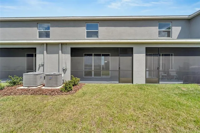 an aerial view of a house with a lake view