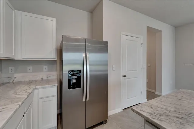 a stove top oven sitting inside of a kitchen