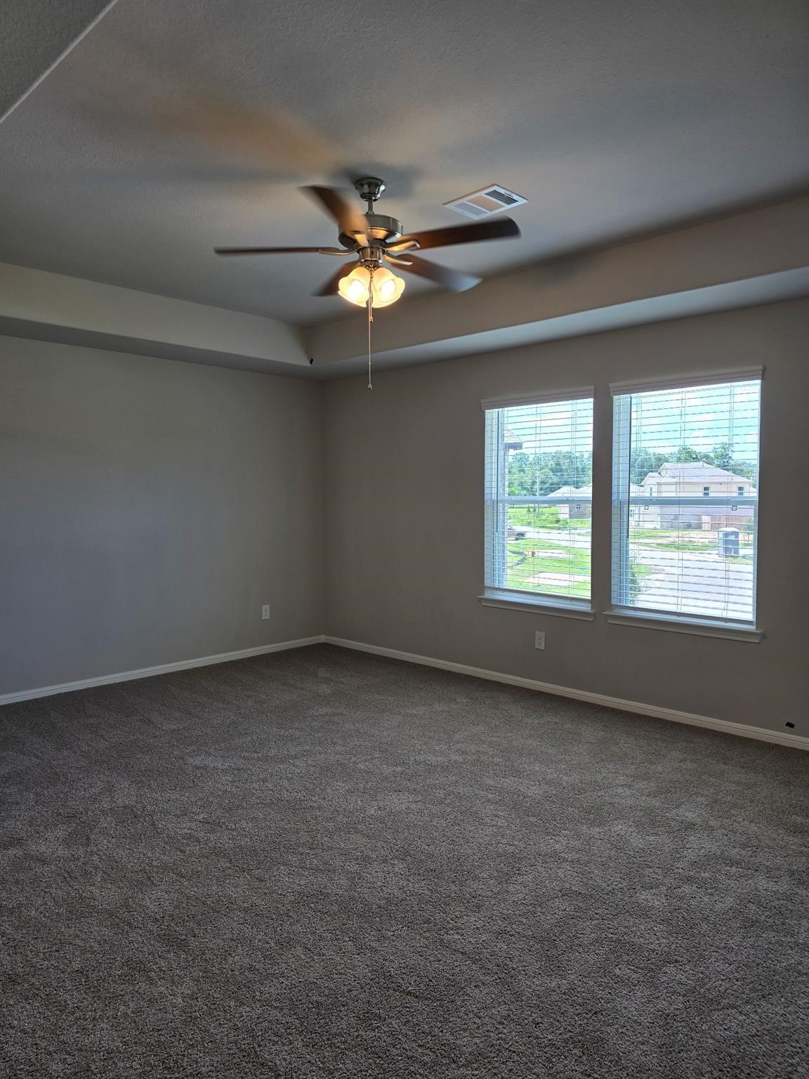 15905 Cy Young Court Splendora, TX 77372 - Photo 11 of 16 an empty room with a ceiling fan and window