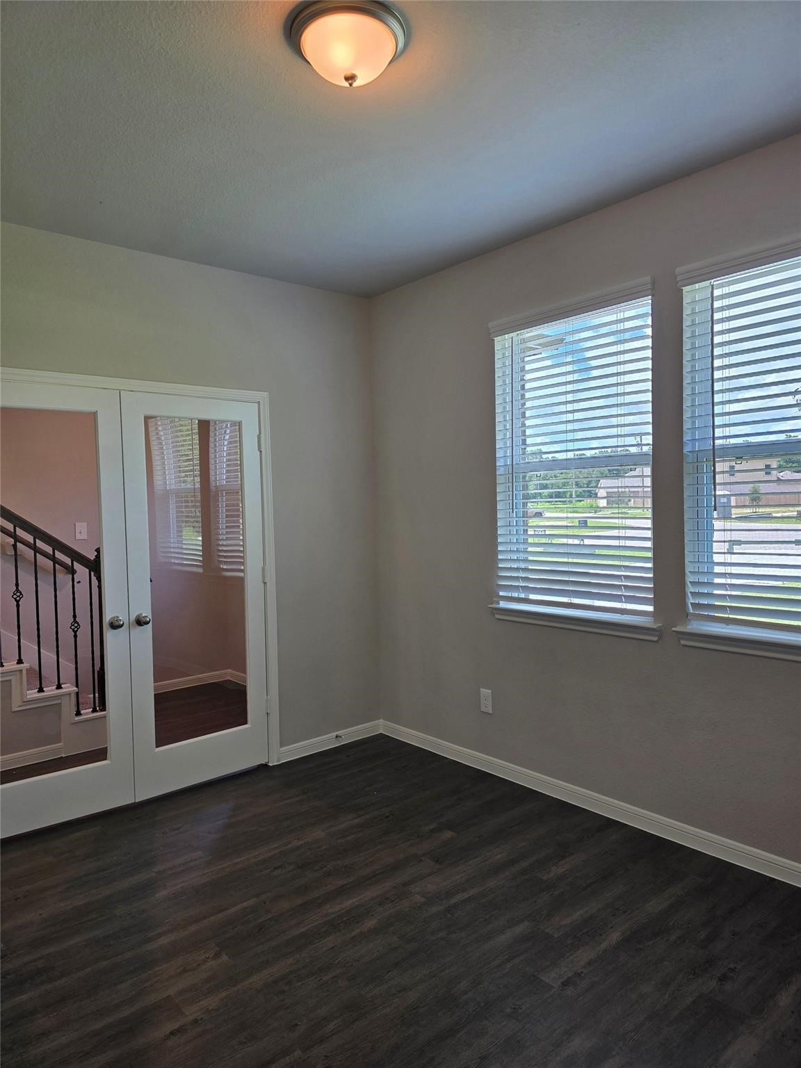 15905 Cy Young Court Splendora, TX 77372 - Photo 6 of 16 an empty room with wooden floor and windows