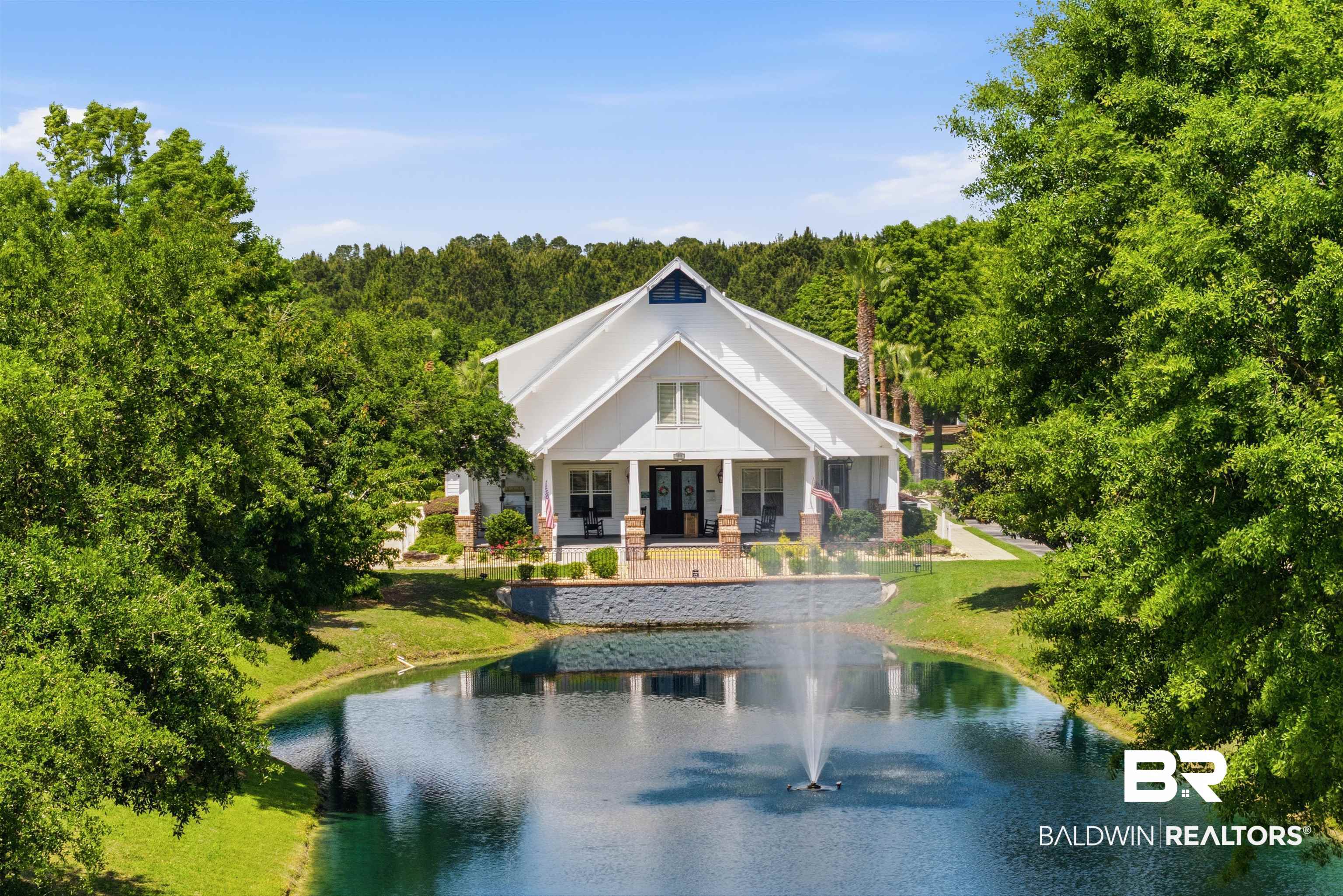 927 Periwinkle Lane Foley, AL 36535 - Photo 21 of 26 White-sided exterior with a prominent gable roofline