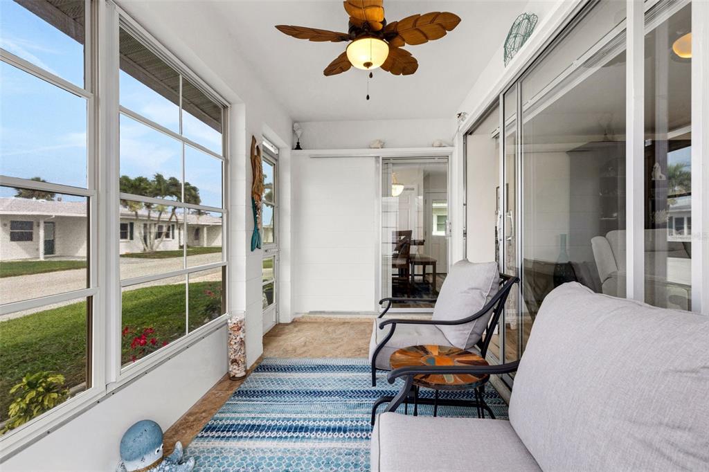 1977 Beach Road, Unit 84 Englewood, FL 34223 - Photo 13 of 42 a bedroom with furniture and a large window