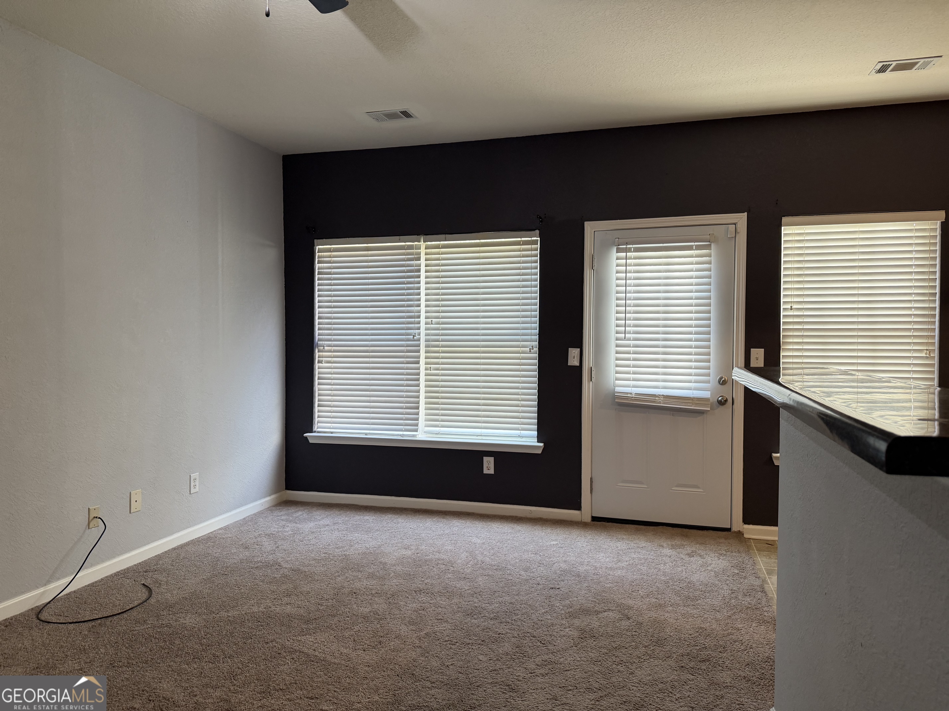 2807 Snapfinger Manor Decatur, GA 30035 - Photo 9 of 17 a view of an empty room with a window
