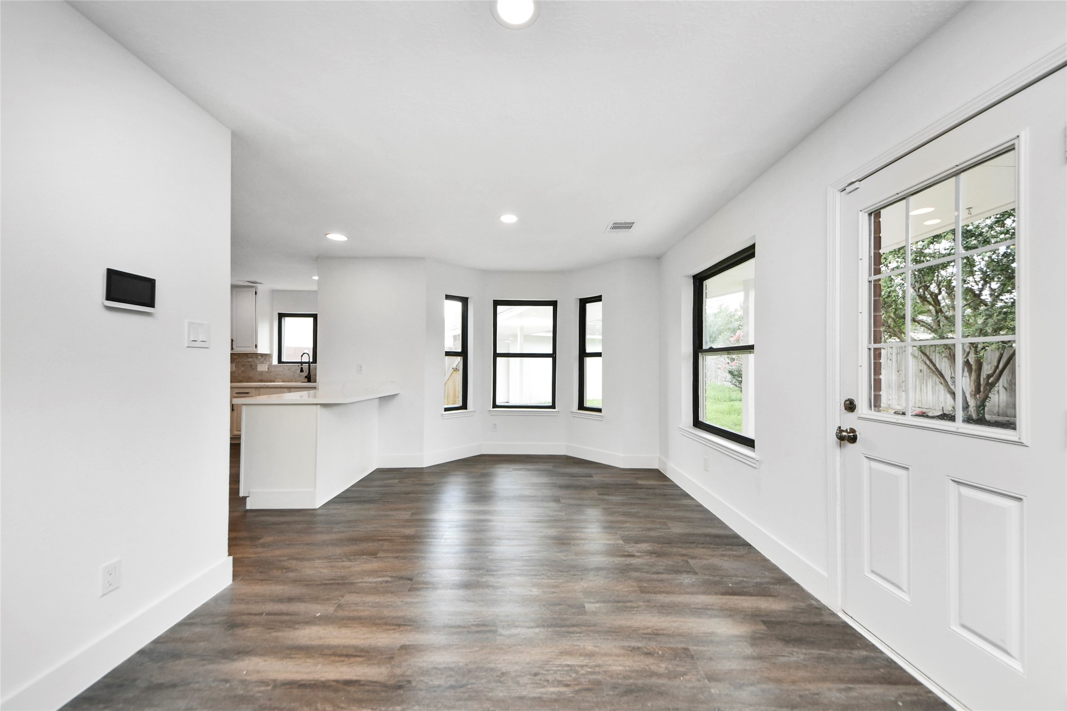 8510 Canyon Pine Drive Spring, TX 77379 - Photo 12 of 42 a view of an empty room with a window and wooden floor