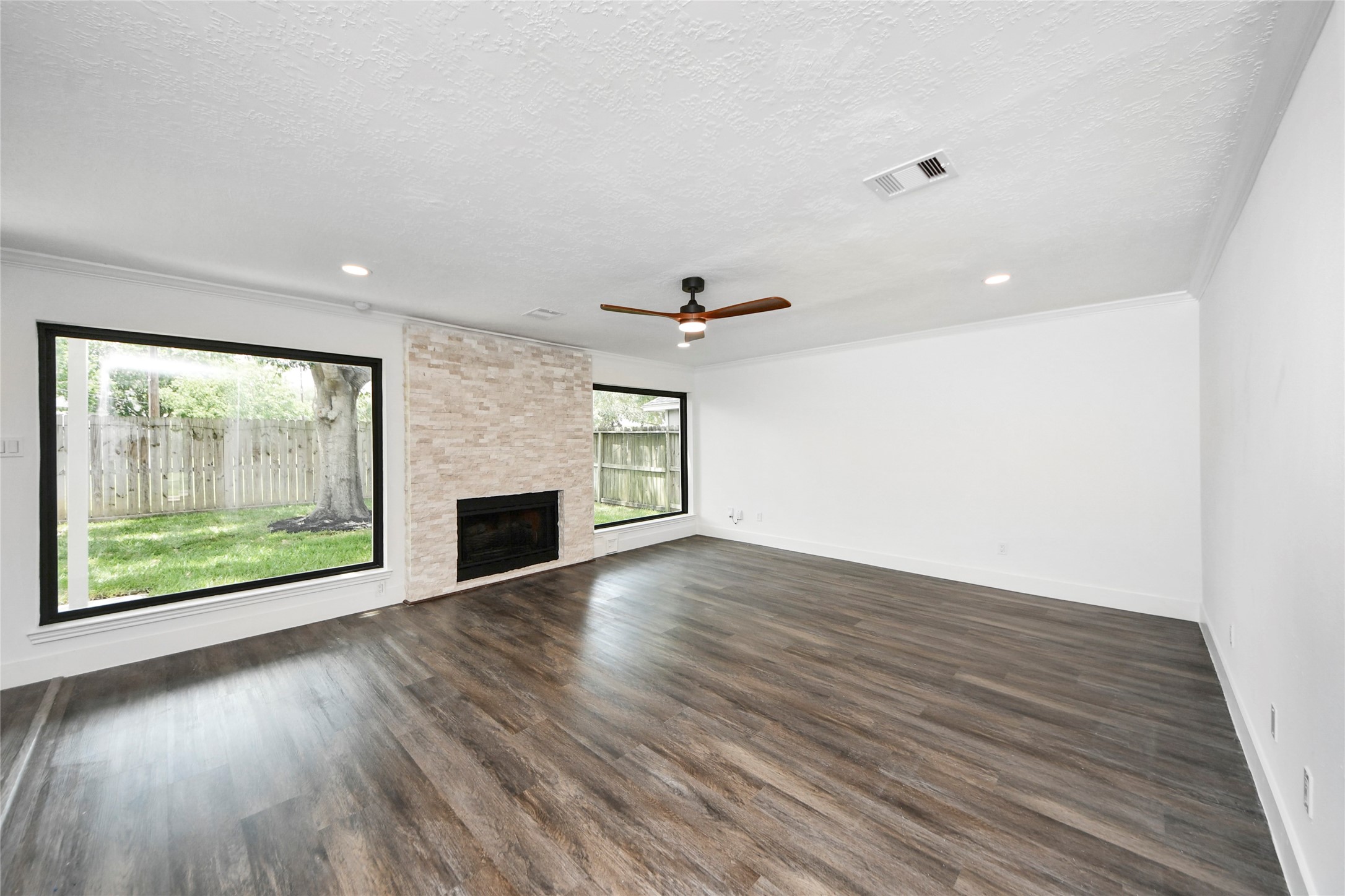 8510 Canyon Pine Drive Spring, TX 77379 - Photo 13 of 42 a view of empty room with wooden floor and fireplace