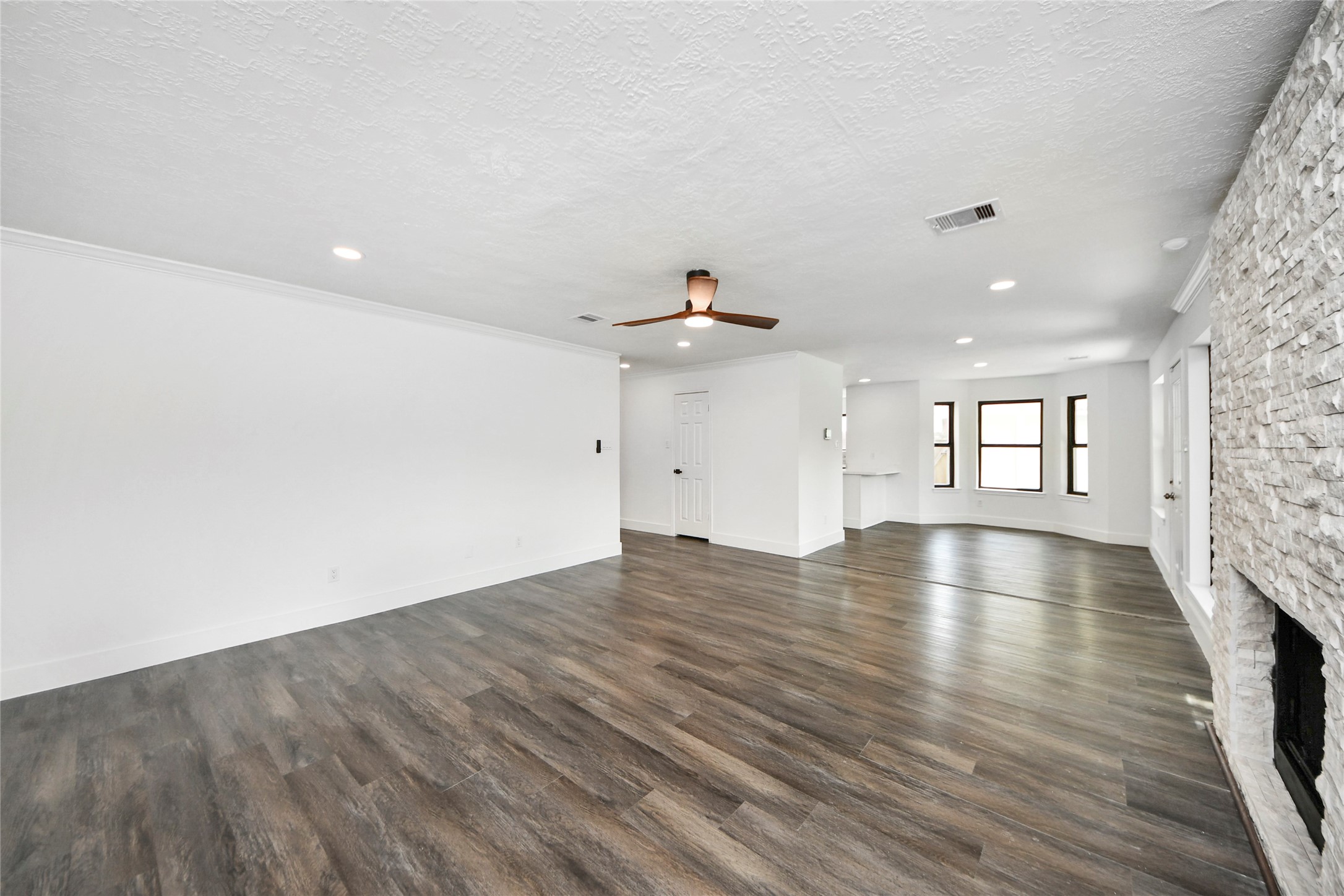 8510 Canyon Pine Drive Spring, TX 77379 - Photo 16 of 42 an empty room with wooden floor and windows