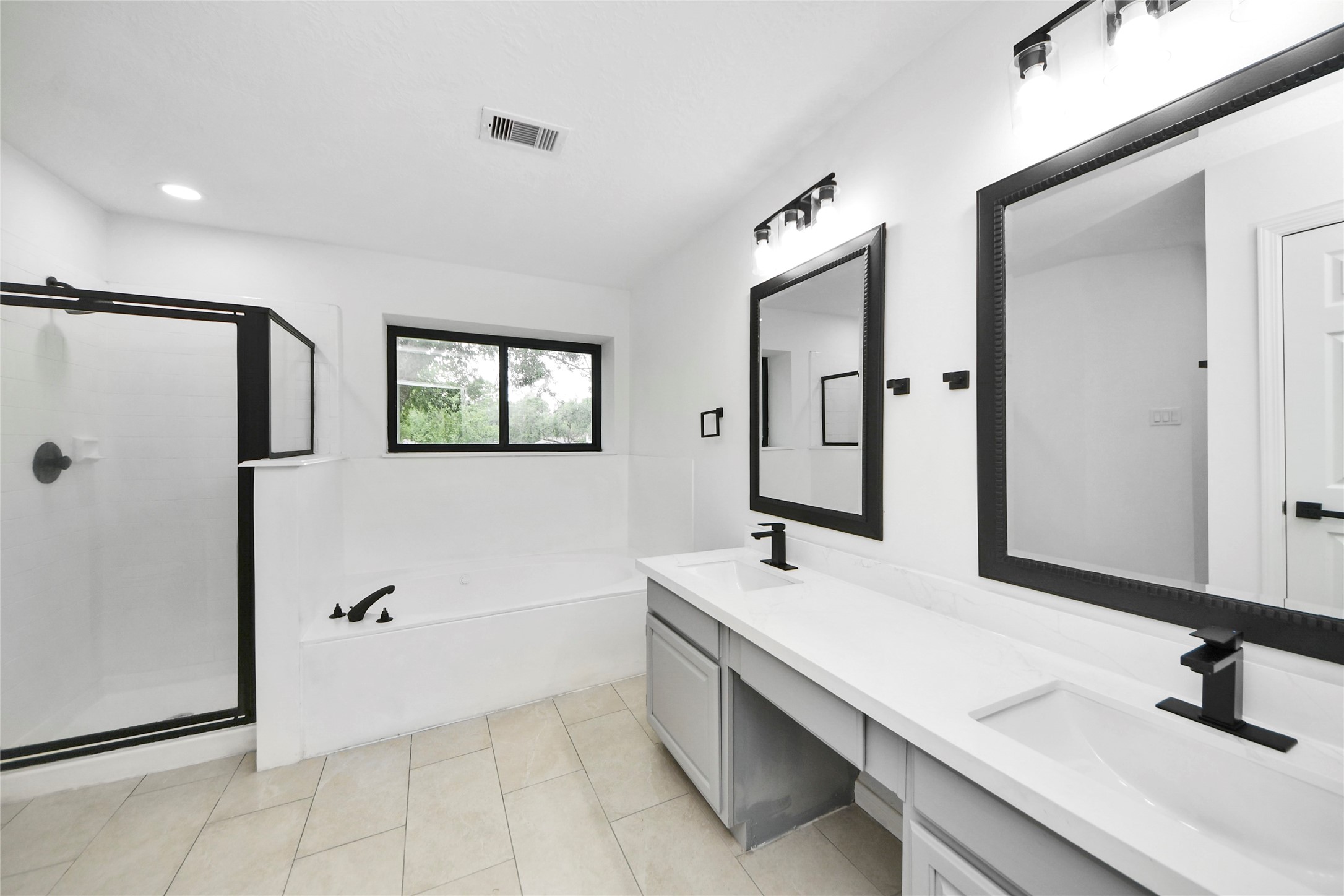 8510 Canyon Pine Drive Spring, TX 77379 - Photo 25 of 42 a bathroom with a tub sink and mirror