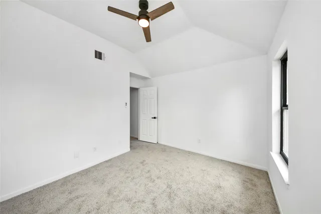 a view of a big room with carpet
