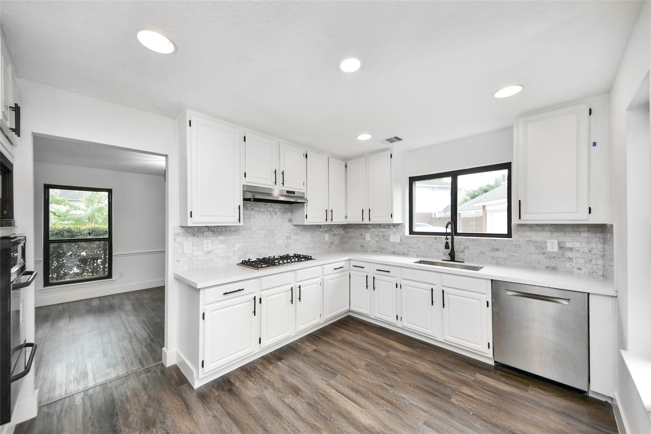 8510 Canyon Pine Drive Spring, TX 77379 - Photo 8 of 42 a kitchen with a sink cabinets and wooden floor