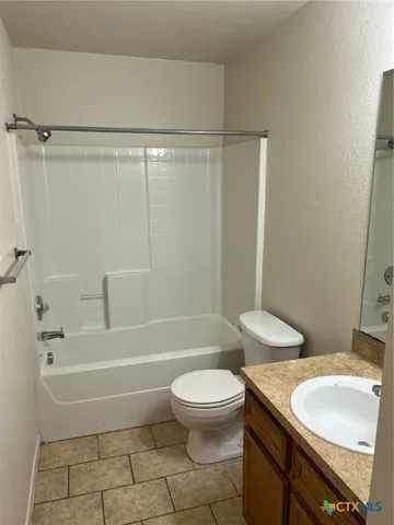 a bathroom with a sink a toilet and a bathtub