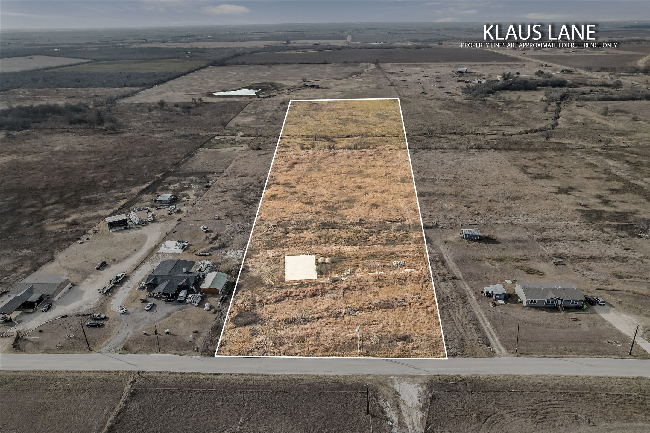 Aerial view of property's location with rural landscape and property parcel outlined