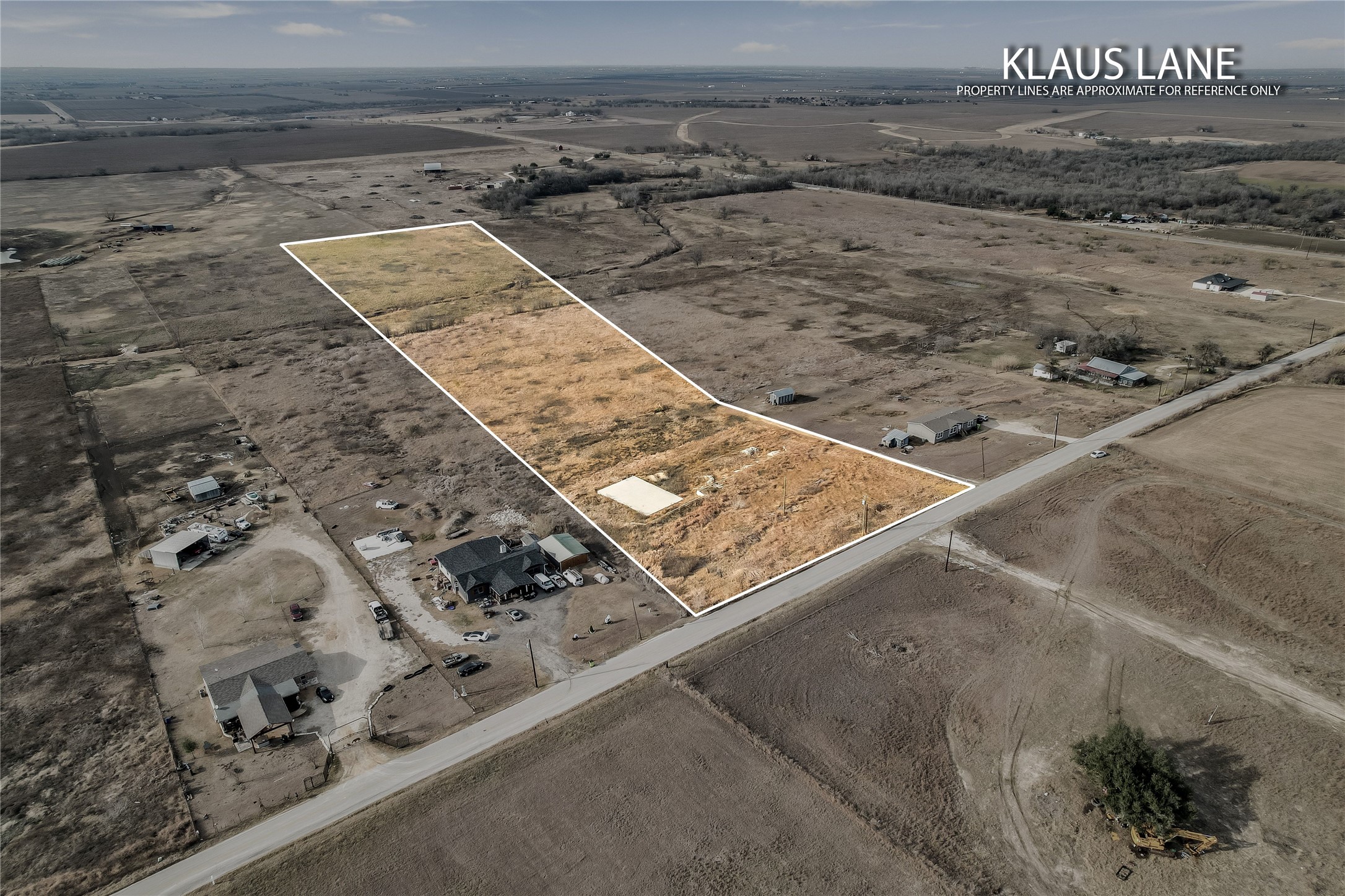 Tbd Klaus Lane Elgin, TX 78621 - Photo 2 of 6 Overview of rural landscape with property boundaries highlighted and a desert landscape