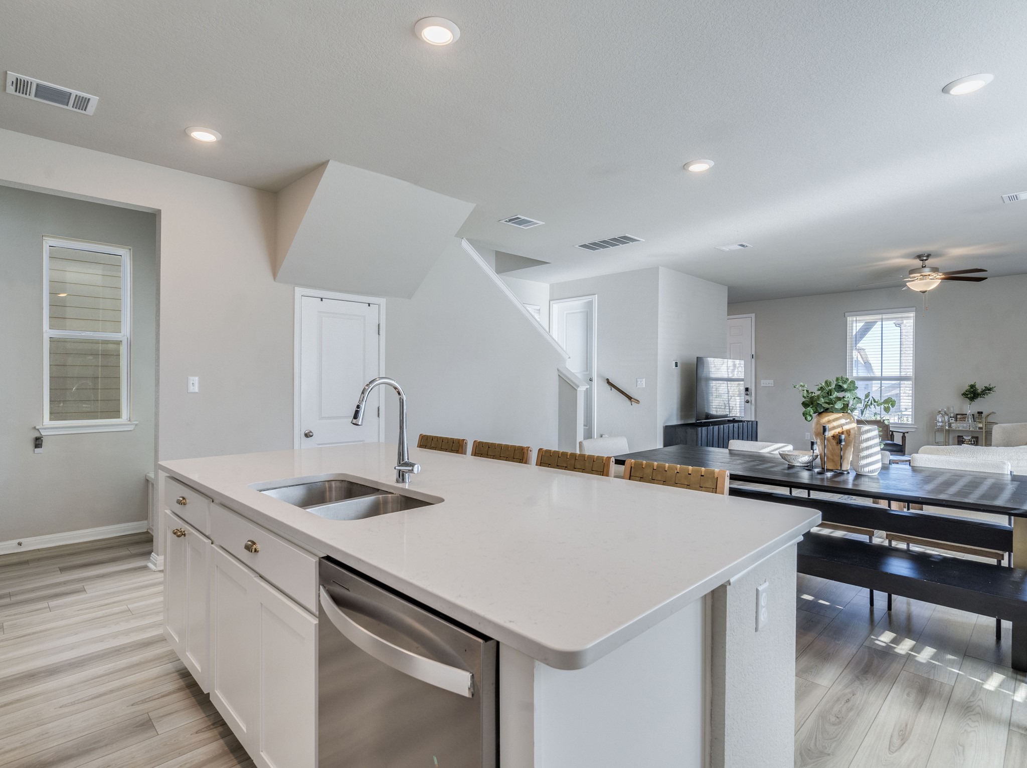 218 Glass Mountain Way Dripping Springs, TX 78620 - Photo 13 of 29 a kitchen with a sink a stove and chairs