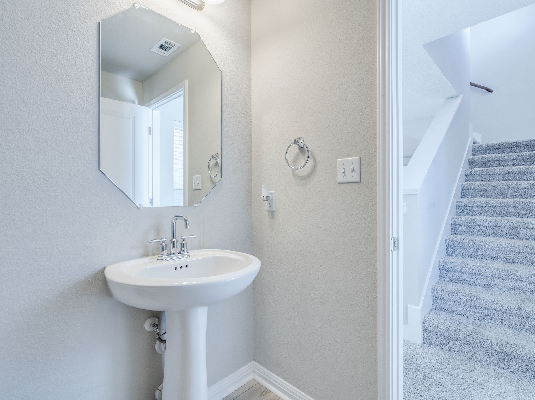 218 Glass Mountain Way Dripping Springs, TX 78620 - Photo 14 of 29 a bathroom with a sink and a mirror