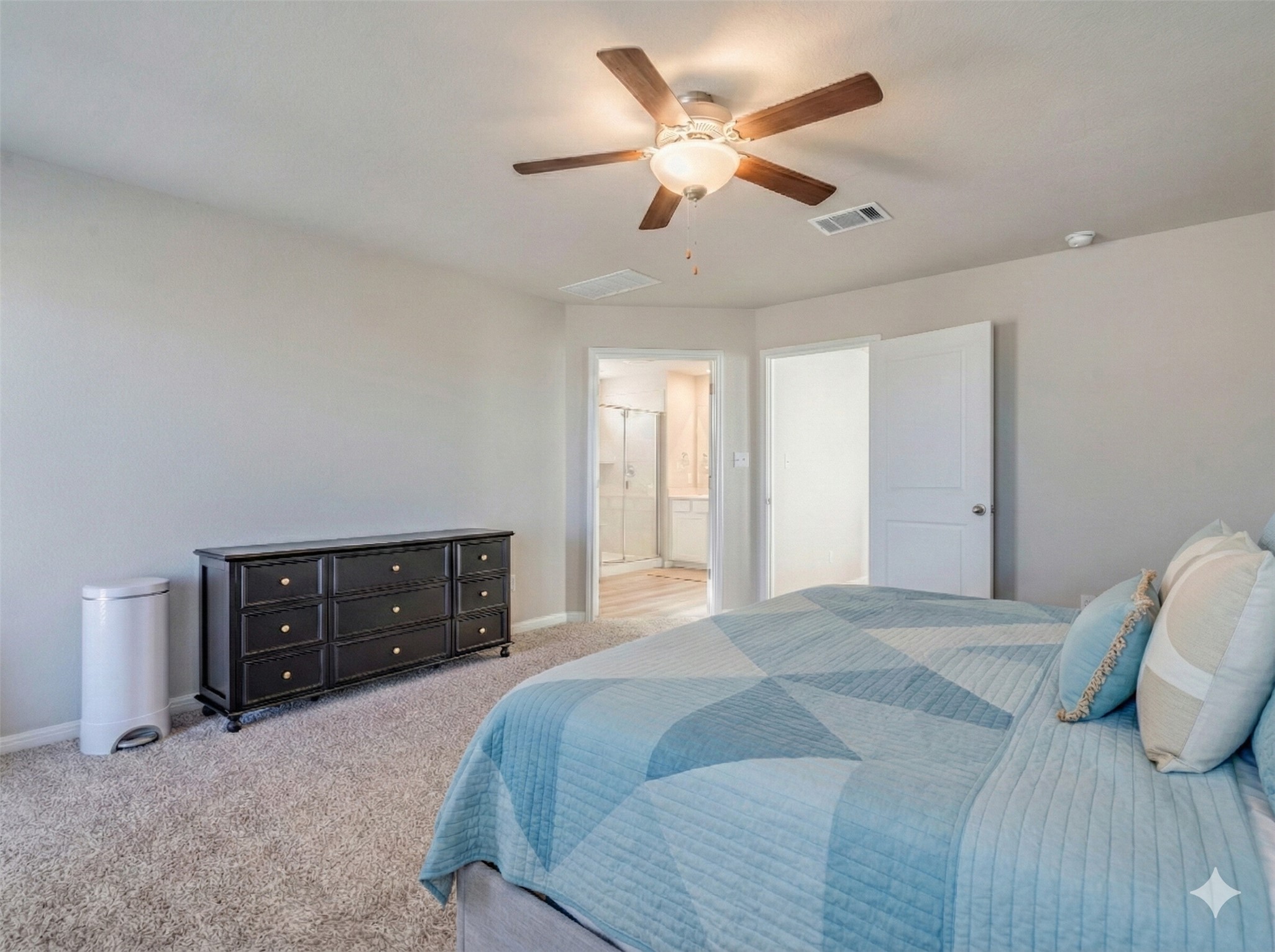 218 Glass Mountain Way Dripping Springs, TX 78620 - Photo 19 of 29 a bedroom with a bed and a dresser