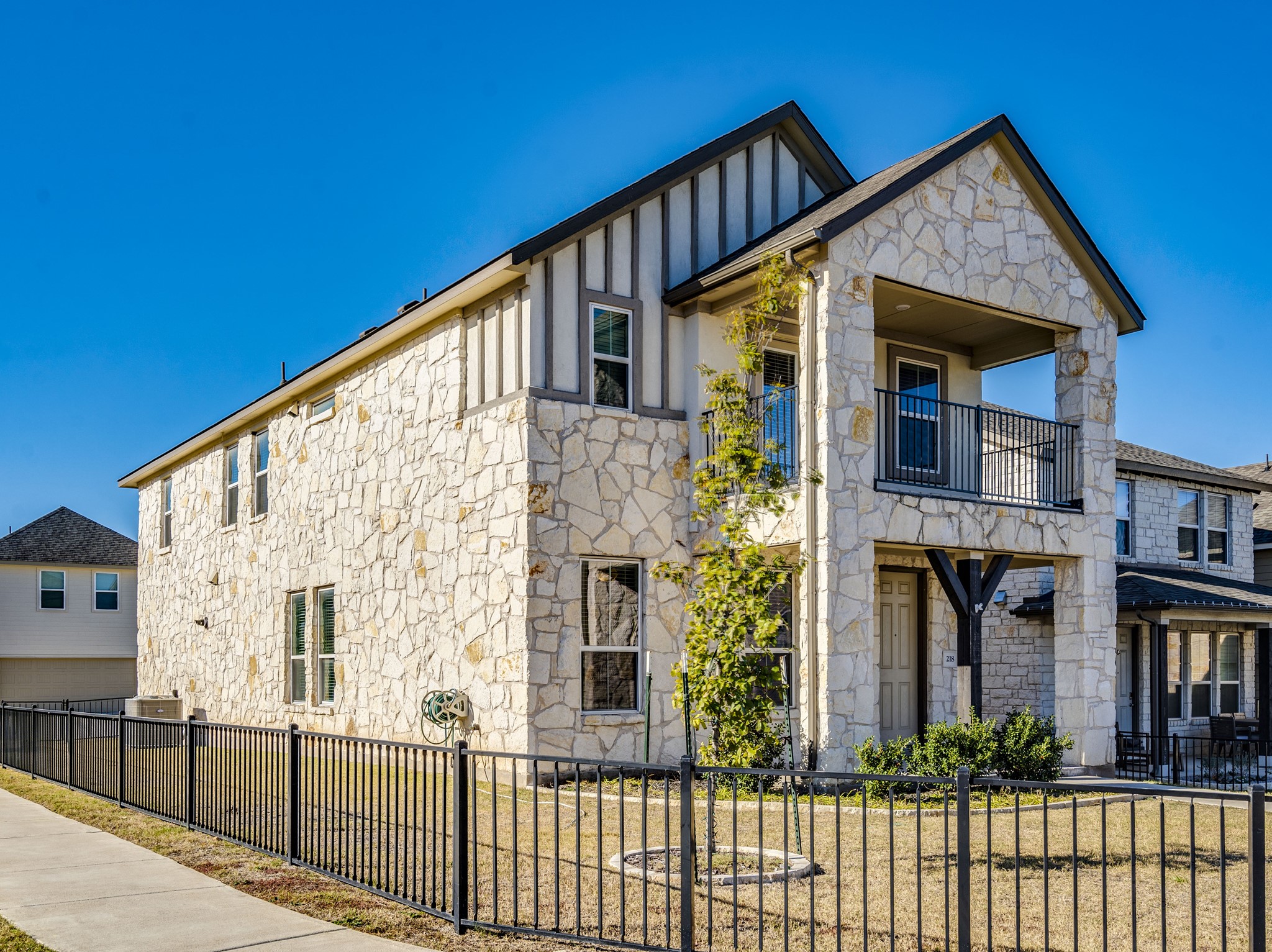 218 Glass Mountain Way Dripping Springs, TX 78620 - Photo 2 of 29 a front view of a house with balcony
